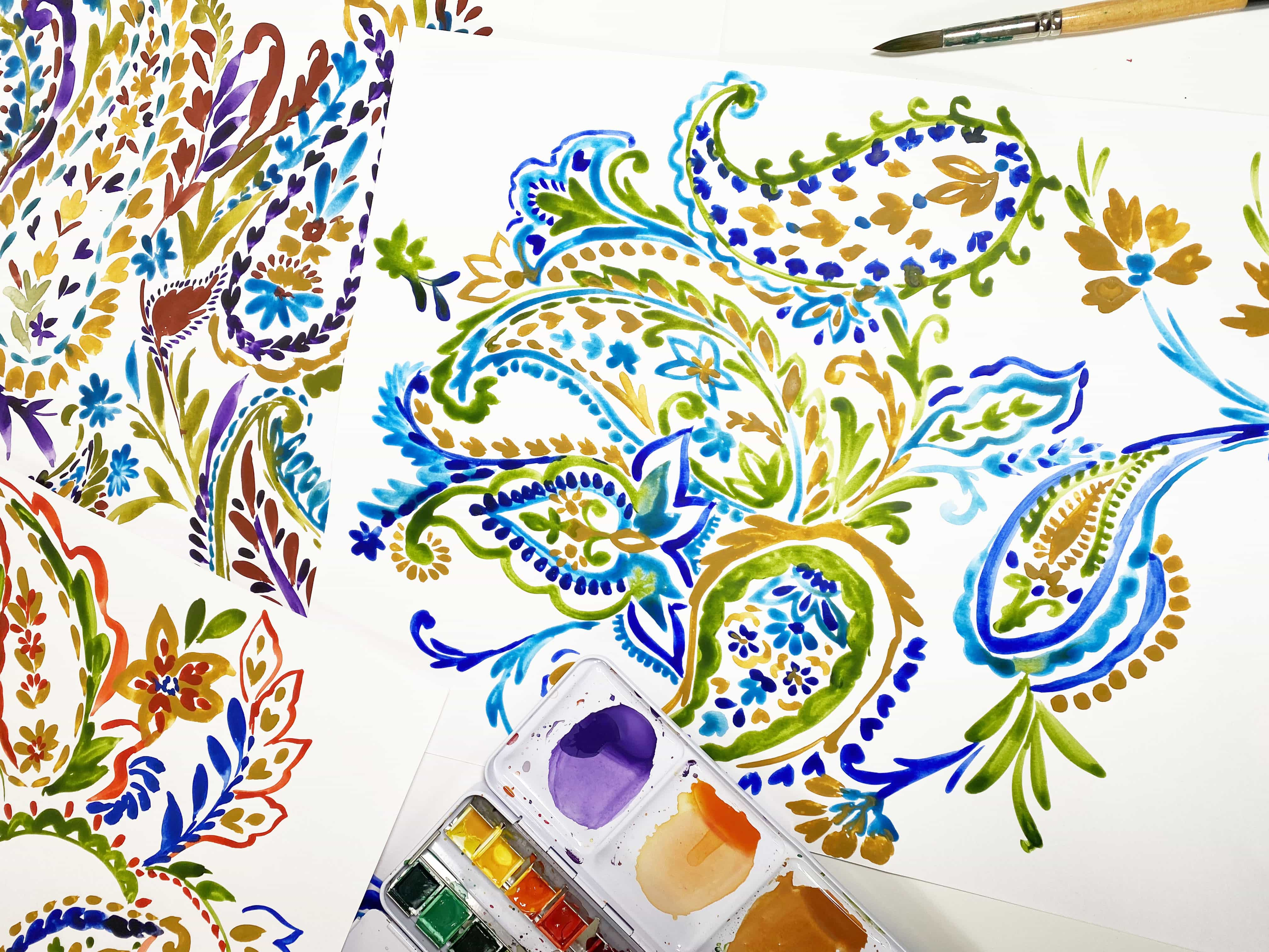 Colourful pattern art work with paint brush and paints